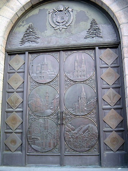 Photo:  Bronze Medallions from Doors of the dining room of the SS Normandie, now adorn the front doors of Our Lady of Lebanon Roman Catholic Church in Brooklyn Heights